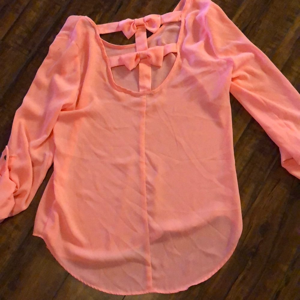 Pink blouse with bows on back